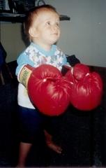 Bradley (one of our boys) at 2 years old getting used to playing with Boxing gloves